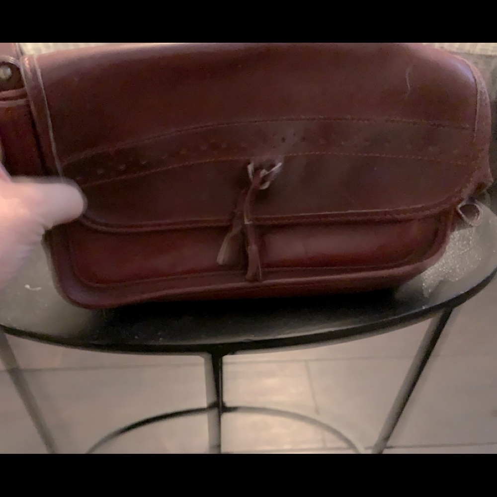Vintage Maroon leather Handbag1970’s)Suede interior, one zippered compartment. .